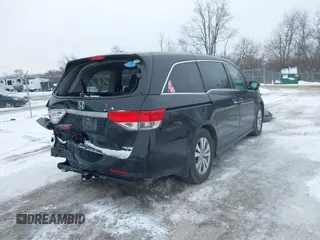 2015 Honda Odyssey EX-L with VIN 5FNRL5H60FB018030, listed as a IAAI auction lot 41608357 with 166,214 mi miles and . Bid and sale history available at carsss.com. Image 4.