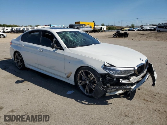 2018 BMW 5 Series M550i xDrive with VIN WBAJB9C51JB287233, listed as a Copart auction lot 55899505 with Not provided miles and Salvage title. Bid and sale history available at DreamBid. Image 4.