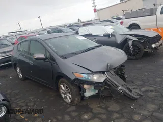 2010 Honda Insight EX with VIN JHMZE2H76AS034115, listed as a IAAI auction lot 42162636 with Not provided miles and . Bid and sale history available at DreamBid. Image 1.