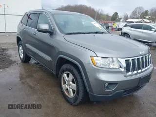2012 Jeep Grand Cherokee Laredo with VIN 1C4RJFAGXCC118823, listed as a IAAI auction lot 41808398 with 153,509 mi miles. Bid and sale history available at carsss.com. Image 1.