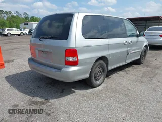 2003 Kia Sedona LX with VIN KNDUP131236417368, listed as a IAAI auction lot 41863624 with 142,896 mi miles. Bid and sale history available at carsss.com. Image 4.