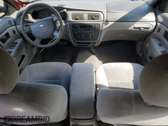 2005 Ford Taurus SE z VIN 1FAFP53U35A106807, wystawiony jako Copart lot #57023025 z przebiegiem 168 727 mil mil oraz Szkoda całkowita • Salvage title. Historia ofert i sprzedaży dostępna na DreamBid. Obrazek 8.