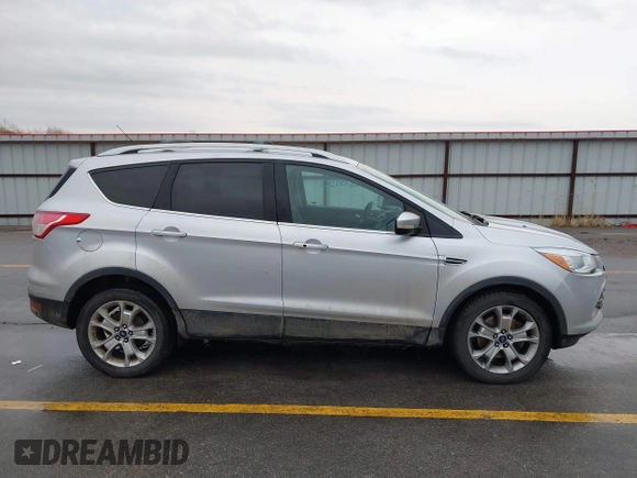 2015 Ford Escape Titanium with VIN 1FMCU9J97FUA84589, listed as a IAAI auction lot 41688156 with 129,073 mi miles. Bid and sale history available at carsss.com. Image 14.