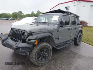 2022 Jeep Wrangler Unlimited Sport with VIN 1C4HJXDN9NW241154, listed as a IAAI auction lot 40211944 with 31,344 mi miles and . Bid and sale history available at DreamBid. Image 2.