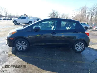 2012 Toyota Yaris L with VIN JTDKTUD31CD500337, listed as a IAAI auction lot 41410723 with 130,881 mi miles. Bid and sale history available at carsss.com. Image 14.