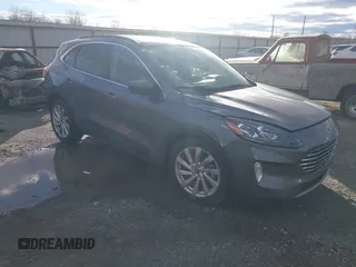 2021 Ford Escape Titanium Hybrid z VIN 1FMCU0DZ0MUB00944, wystawiony jako IAAI lot #41202146 z przebiegiem 52 458 mil mil oraz . Historia ofert i sprzedaży dostępna na DreamBid. Obrazek 1.