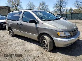 1999 Toyota Sienna LE with VIN 4T3ZF13C2XU112113, listed as a Copart auction lot 52162655 with 248,091 mi miles and Salvage Title. Bid and sale history available at carsss.com. Image 4.