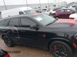 2023 Dodge Durango SRT Hellcat Premium with VIN 1C4SDJH99PC584770, listed as a IAAI auction lot 41562157 with 14,598 mi miles and . Bid and sale history available at DreamBid. Image 13.
