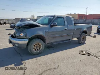 2002 Ford F-150 XL with VIN 1FTPX18L32NB65156, listed as a Copart auction lot 61418955 with 176,622 mi miles and Salvage title. Bid and sale history available at DreamBid. Image 1.