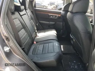 2022 Honda CR-V Touring z VIN 7FARW2H96NE052072, wystawiony jako Copart lot #52214465 z przebiegiem 63 832 mil mil oraz Szkoda całkowita • Salvage title. Historia ofert i sprzedaży dostępna na DreamBid. Obrazek 11.