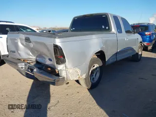 1999 Ford F-150 with VIN 1FTZX1729XKA58767, listed as a IAAI auction lot 41392815 with 342,029 mi miles and . Bid and sale history available at DreamBid. Image 4.
