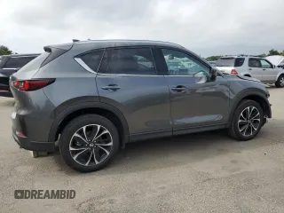 2023 Mazda CX-5 2.5 S Premium Package with VIN JM3KFBDM5P0229694, listed as a Copart auction lot 64811974 with 9,901 mi miles and Non Repairable. Bid and sale history available at carsss.com. Image 3.