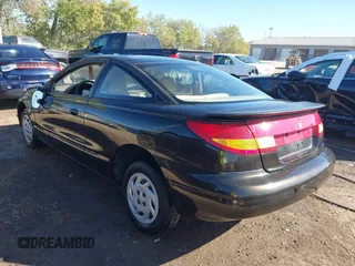 1997 Saturn SC z VIN 1G8ZE1283VZ163658, wystawiony jako IAAI lot #40494467 z przebiegiem 111 701 mil mil oraz . Historia ofert i sprzedaży dostępna na DreamBid. Obrazek 3.