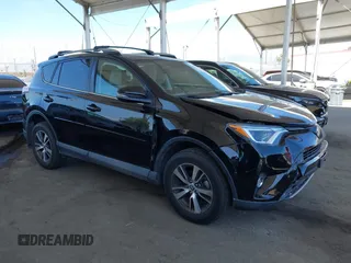 2018 Toyota RAV4 XLE with VIN 2T3WFREV2JW502622, listed as a IAAI auction lot 42327598 with 94,997 mi miles and . Bid and sale history available at DreamBid. Image 1.