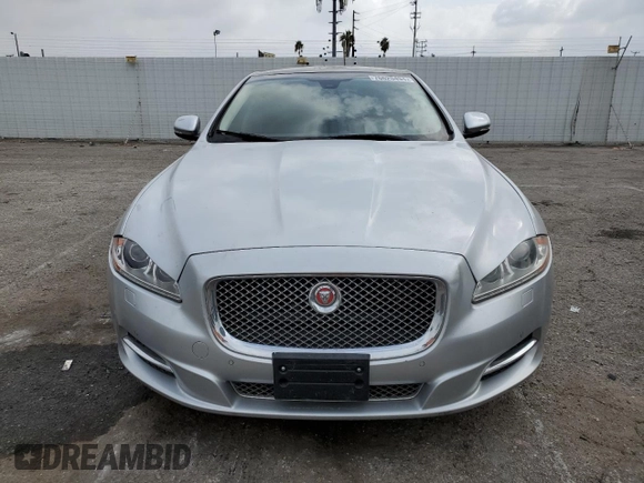 2014 Jaguar XJ Portfolio with VIN SAJWJ2GD2E8V62696, listed as a Copart auction lot 76620494 with 85,487 mi miles and Salvage title. Bid and sale history available at DreamBid. Image 5.