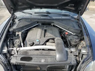 2012 BMW X5 35i with VIN 5UXZV4C59CL752661, listed as a Copart auction lot 58590305 with 101,725 mi miles and Salvage title. Bid and sale history available at DreamBid. Image 12.