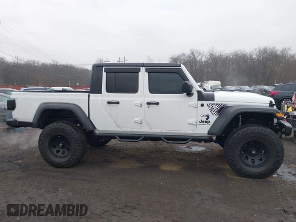 2020 Jeep Gladiator Sport S z VIN 1C6HJTAG0LL129461, wystawiony jako IAAI lot #41464713 z przebiegiem 66 625 mil mil oraz . Historia ofert i sprzedaży dostępna na DreamBid. Obrazek 13.
