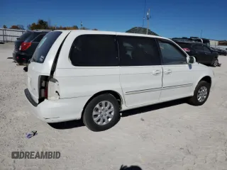 2004 Kia Sedona LX with VIN KNDUP131046585706, listed as a Copart auction lot 74973304 with 107,130 mi miles and Salvage Title. Bid and sale history available at carsss.com. Image 3.