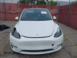 2023 Tesla Model Y Long Range with VIN 7SAYGAEE9PF702910, listed as a IAAI auction lot 42199519 with 91,094 mi miles and . Bid and sale history available at DreamBid. Image 12.