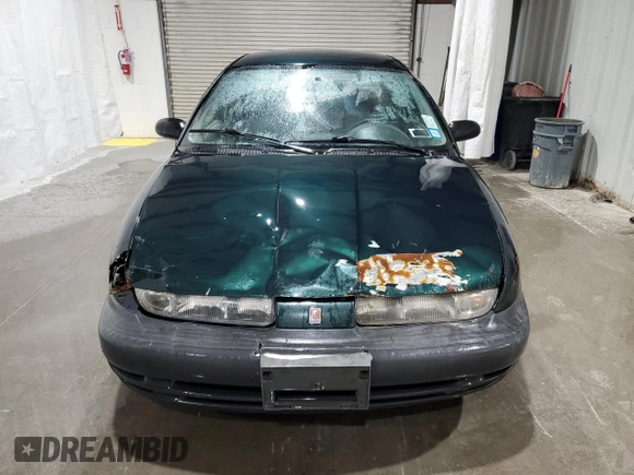 1998 Saturn SL z VIN 1G8ZH5280WZ312544, wystawiony jako Copart lot #50971665 z przebiegiem 119 855 mil mil oraz Szkoda całkowita • Salvage title. Historia ofert i sprzedaży dostępna na DreamBid. Obrazek 5.