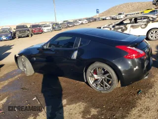 2014 Nissan 370Z Nismo z VIN JN1AZ4EHXEM632166, wystawiony jako Copart lot #88311915 z przebiegiem 18 414 mil mil oraz Szkoda całkowita • Salvage title. Historia ofert i sprzedaży dostępna na DreamBid. Obrazek 2.