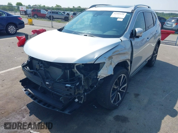 2017 Nissan Rogue SV with VIN 5N1AT2MV0HC832876, listed as a IAAI auction lot 42389131 with 73,856 mi miles and . Bid and sale history available at DreamBid. Image 6.
