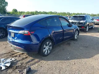 2023 Tesla Model Y Long Range with VIN 7SAYGDEE0PF671726, listed as a IAAI auction lot 42393616 with Not provided miles and . Bid and sale history available at DreamBid. Image 4.