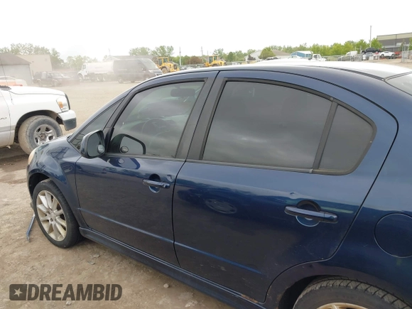 2009 Suzuki SX4 Sport FWD z VIN JS2YC414196200260, wystawiony jako IAAI lot #42354835 z przebiegiem 175 909 mil mil oraz . Historia ofert i sprzedaży dostępna na DreamBid. Obrazek 14.