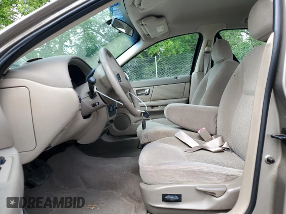 2003 Ford Taurus SES Standard z VIN 1FAFP55U33A123732, wystawiony jako Copart lot #58837395 z przebiegiem 169 159 mil mil oraz Szkoda całkowita • Salvage title. Historia ofert i sprzedaży dostępna na DreamBid. Obrazek 7.