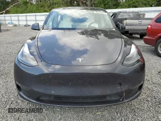2024 Tesla Model Y Long Range with VIN 7SAYGDEE4RA285620, listed as a Copart auction lot 57883015 with 18,841 mi miles and Salvage title. Bid and sale history available at DreamBid. Image 5.