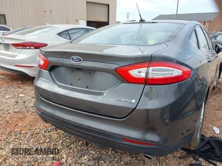 2015 Ford Fusion S Hybrid with VIN 3FA6P0UU7FR167229, listed as a IAAI auction lot 41684934 with 135,317 mi miles. Bid and sale history available at carsss.com. Image 16.