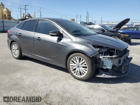 2017 Ford Focus Titanium with VIN 1FADP3J22HL279854, listed as a Copart auction lot 61209135 with 106,323 mi miles and Salvage title. Bid and sale history available at DreamBid. Image 4.