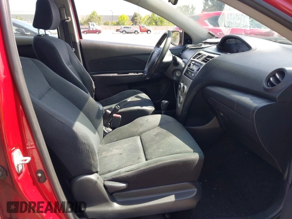 2009 Toyota Yaris with VIN JTDBT903591342243, listed as a IAAI auction lot 42104557 with 407,106 mi miles. Bid and sale history available at carsss.com. Image 5.