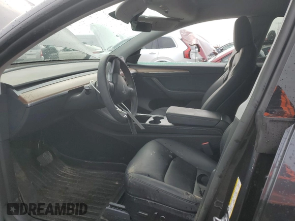 2024 Tesla Model Y Long Range with VIN 7SAYGAEE7RF043096, listed as a Copart auction lot 46939395 with 12,521 mi miles and Salvage Title. Bid and sale history available at DreamBid. Image 7.