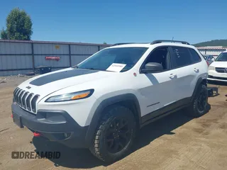 2014 Jeep Cherokee Trailhawk with VIN 1C4PJMBSXEW236807, listed as a IAAI auction lot 42660980 with 157,225 mi miles and . Bid and sale history available at DreamBid. Image 21.