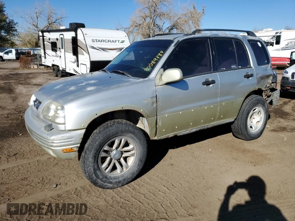 1999 Suzuki Grand Vitara JLX z VIN JS3TD62V0X4113058, wystawiony jako Copart lot #80089884 z przebiegiem 165 794 mil mil oraz Szkoda całkowita • Salvage title. Historia ofert i sprzedaży dostępna na DreamBid. Obrazek 1.