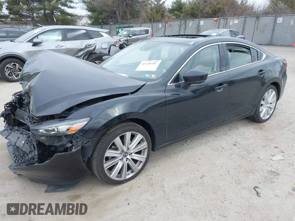 2021 Mazda Mazda6 Touring with VIN JM1GL1VM1M1604566, listed as a IAAI auction lot 41728787 with 68,636 mi miles. Bid and sale history available at carsss.com. Image 17.
