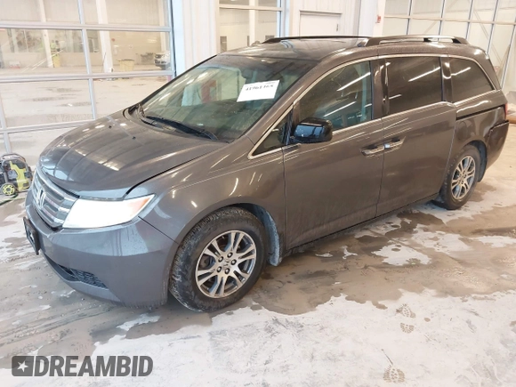 2012 Honda Odyssey EX-L with VIN 5FNRL5H66CB127507, listed as a IAAI auction lot 41961465 with 228,972 mi miles and . Bid and sale history available at carsss.com. Image 2.