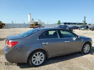 2012 Lincoln MKZ Hybrid z VIN 3LNDL2L33CR812788, wystawiony jako Copart lot #61068125 z przebiegiem 246 016 mil mil oraz Szkoda całkowita • Salvage title. Historia ofert i sprzedaży dostępna na DreamBid. Obrazek 3.