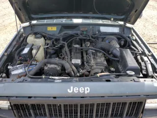 1993 Jeep Cherokee SE with VIN 1J4FJ28S0PL594889, listed as a Copart auction lot 50103425 with 174,333 mi miles and Salvage Title. Bid and sale history available at carsss.com. Image 12.