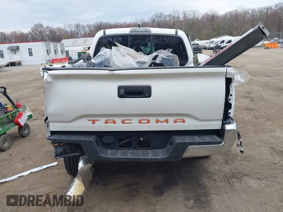 2022 Toyota Tacoma SR with VIN 3TYAX5GN3NT062077, listed as a IAAI auction lot 41886531 with 58,687 mi miles and . Bid and sale history available at DreamBid. Image 16.