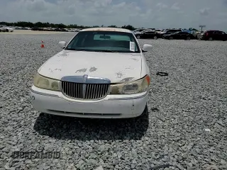 1999 Lincoln Town Car Executive z VIN 1LNHM81WXXY627319, wystawiony jako Copart lot #60830165 z przebiegiem 122 118 mil mil oraz Szkoda całkowita • Salvage title. Historia ofert i sprzedaży dostępna na DreamBid. Obrazek 13.