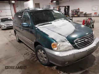 2003 Kia Sedona LX with VIN KNDUP131336390410, listed as a IAAI auction lot 41602426 with 170,613 mi miles. Bid and sale history available at carsss.com. Image 1.