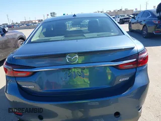 2018 Mazda 6 Grand Touring with VIN JM1GL1TY4J1333021, listed as a IAAI auction lot 41818719 with 56,188 mi miles and . Bid and sale history available at DreamBid. Image 16.