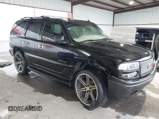 2003 GMC Yukon Denali z VIN 1GKEK63U23J210703, wystawiony jako IAAI lot #41617495 z przebiegiem 187 293 mil mil oraz . Historia ofert i sprzedaży dostępna na DreamBid. Obrazek 1.