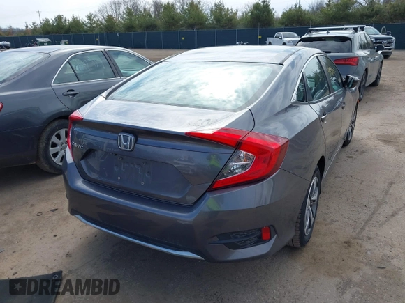 2019 Honda Civic LX with VIN 19XFC2F61KE037495, listed as a IAAI auction lot 41891007 with 90,262 mi miles and . Bid and sale history available at DreamBid. Image 4.