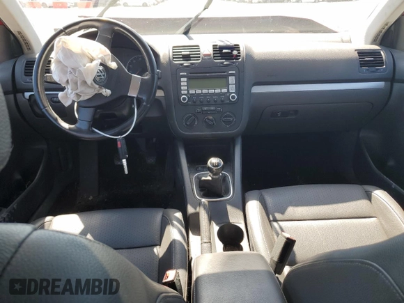 2009 Volkswagen Jetta SE with VIN 3VWRZ71K69M177746, listed as a Copart auction lot 70990074 with 128,390 mi miles and Salvage title. Bid and sale history available at DreamBid. Image 8.