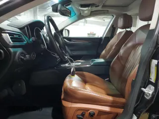2015 Maserati Ghibli z VIN ZAM57XSA9F1139087, wystawiony jako Copart lot #52235355 z przebiegiem 68 788 mil mil oraz Szkoda całkowita • Salvage title. Historia ofert i sprzedaży dostępna na DreamBid. Obrazek 7.