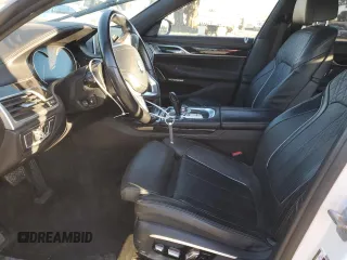 2016 BMW 7 Series 750i xDrive with VIN WBA7B0C59GG526741, listed as a Copart auction lot 86312384 with 90,360 mi miles and Salvage title. Bid and sale history available at DreamBid. Image 7.