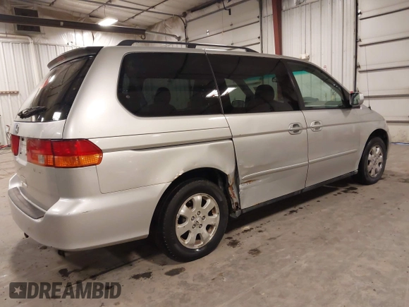 2004 Honda Odyssey EX-L with VIN 5FNRL18974B127696, listed as a IAAI auction lot 41643243 with 200,286 mi miles and . Bid and sale history available at DreamBid. Image 4.